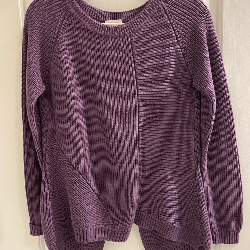 Wrap London open back knit sweater.